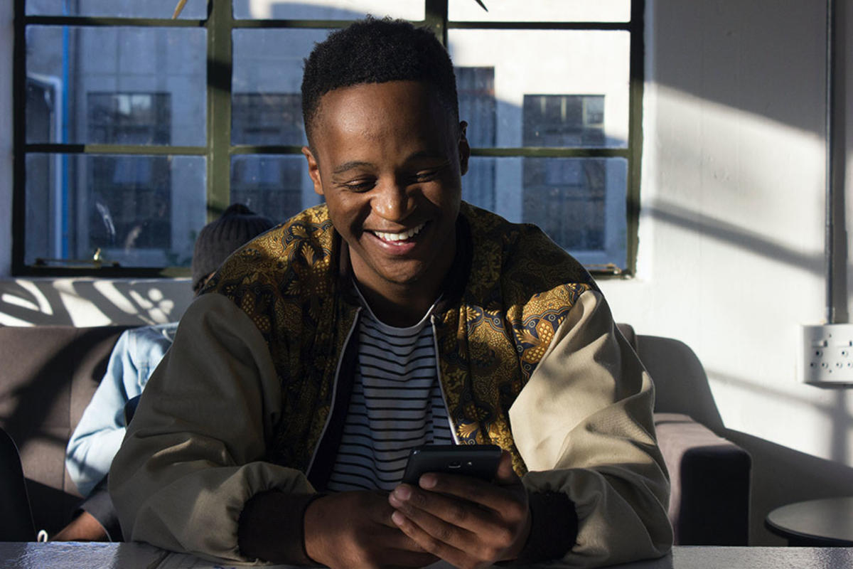 Happy-guy-looking-at-phone-blog-banner